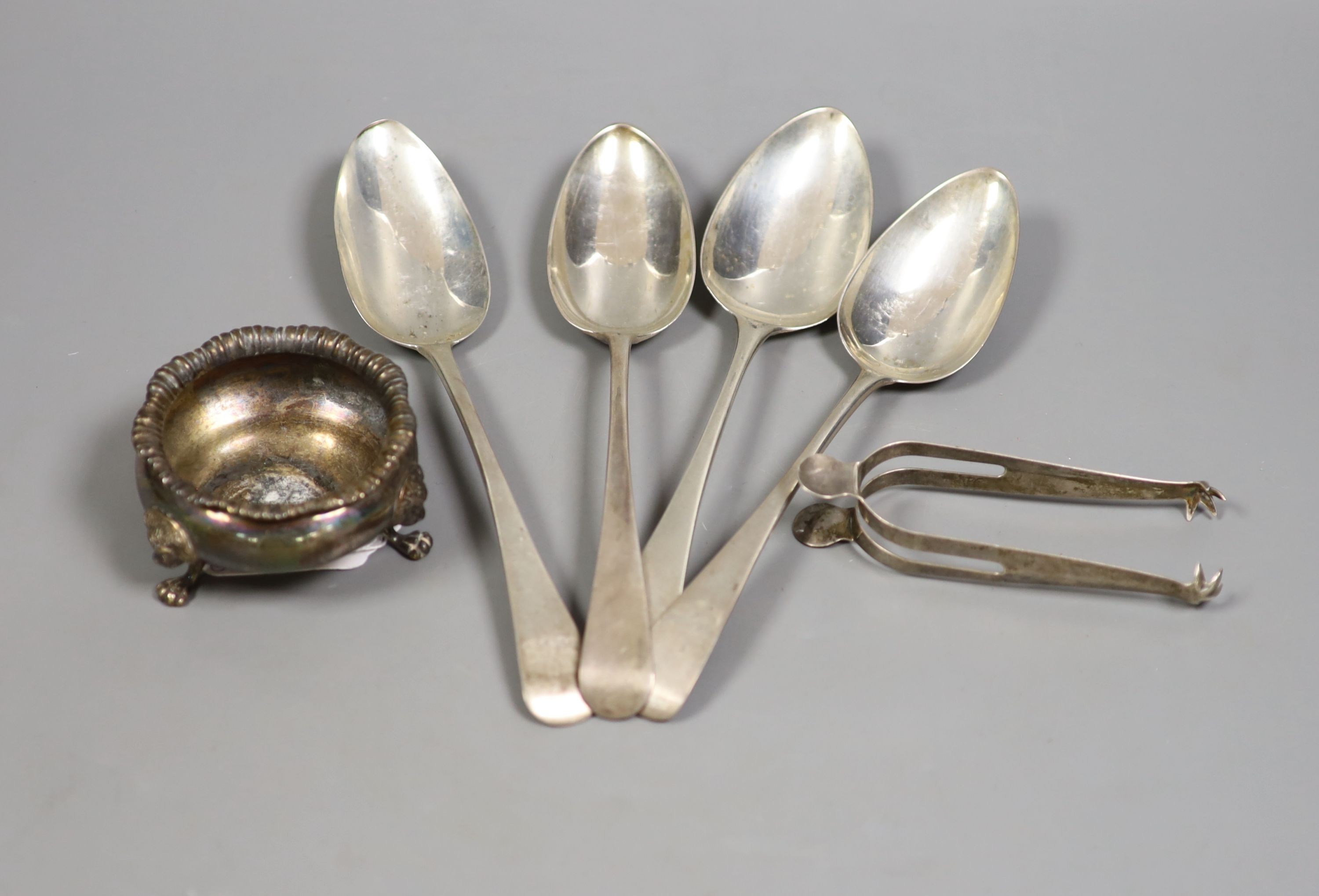 Four various George III silver Old English pattern tablespoons, a later silver salt and pair of silver sugar tongs, 11oz.